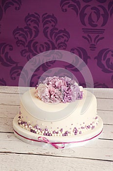 Wedding cake with sugar flowers photo