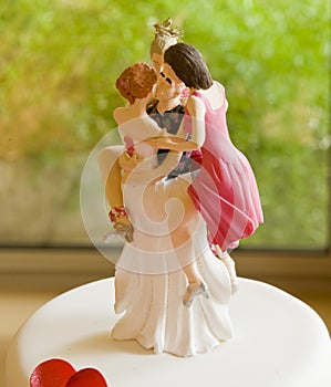 Wedding Cake Topper Depicting One Man with Several Women