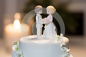 Wedding cake topper with two brides. Gay marriage concept.