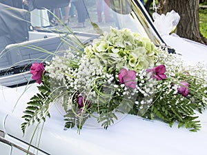 Wedding car decorated with flowers