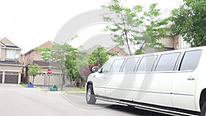 Wedding car decoration. Stretch limo. White limousine. White stretch limousine with partly cloudy blue sky. Long white