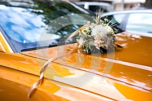 Wedding car.Wedding decoration on wedding car. Luxury wedding car decorated with flowers