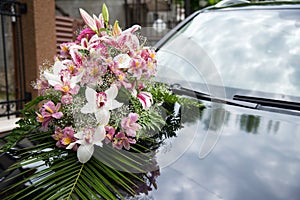 Wedding car. Wedding decoration on wedding car. Luxury wedding car decorated with flowers