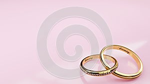 Wedding card Eternity - pink background and two golden rings joined together forever with engraved words