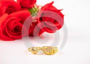 Wedding celebration on valentines day with red rose bouquet, wedding rings, isolated on white background. Concept of love and