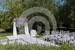 Wedding ceremony arch in white, violet, blue, pink colors