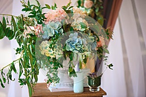 Wedding ceremony decoration, bunches of flowers, gifts. Beautiful natural flowers.
