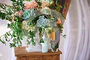 Wedding ceremony decoration, bunches of flowers, gifts. Beautiful natural flowers.