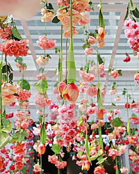 Wedding ceremony decoration with many artificial flower hanging from ceiling. Beautiful Upside down flowers