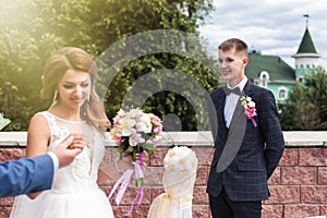 Wedding ceremony. Father hands the bride to the groom.