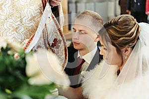 Wedding ceremony of happy elegant blonde bride and stylish groom