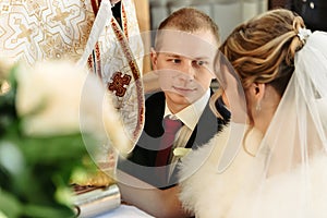 Wedding ceremony of happy elegant blonde bride and stylish groom