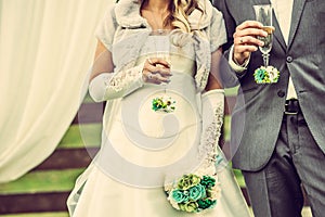 Wedding ceremony, newlywed couple with champagne glasses