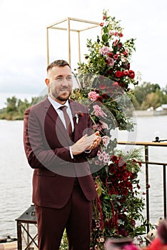 Wedding ceremony of the newlyweds on the pier