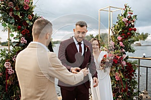 Wedding ceremony of the newlyweds on the pier