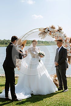 wedding ceremony of the newlyweds on the pier