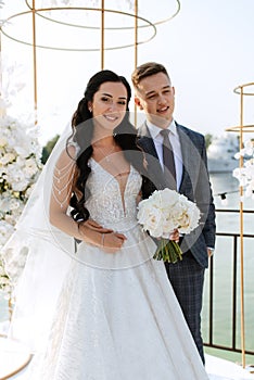 wedding ceremony of the newlyweds on the pier