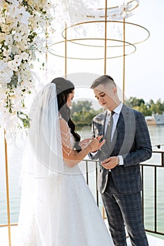 wedding ceremony of the newlyweds on the pier