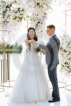 wedding ceremony of the newlyweds on the pier