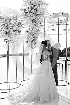 wedding ceremony of the newlyweds on the pier