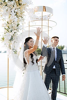 wedding ceremony of the newlyweds on the pier