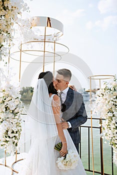 wedding ceremony of the newlyweds on the pier