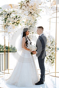 wedding ceremony of the newlyweds on the pier