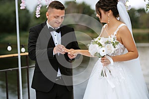 wedding ceremony of the newlyweds on the pier