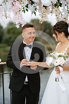 wedding ceremony of the newlyweds on the pier