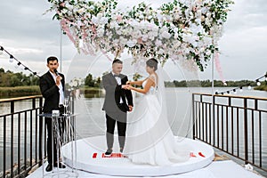 wedding ceremony of the newlyweds on the pier