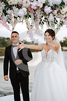 wedding ceremony of the newlyweds on the pier