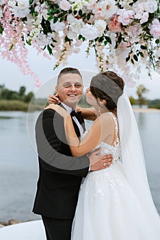 wedding ceremony of the newlyweds on the pier