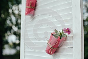 Wedding ceremony in outside, rustik style. White door arch in green tree background