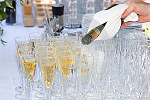 Wedding ceremony in the park glass of champagne served outdoor with a buffet table