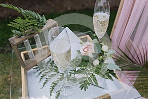 Wedding ceremony table with glasses and rings