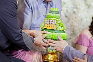 Wedding ceremony in Thai culture. Flower and Candle design on tray for Bride and groom paying respects to the Elders in Thai weddi