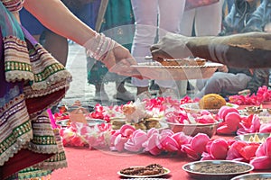 Wedding ceremony, traditional indian hindu marriage ritual with red flowers and attributes