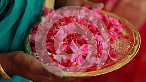 Wedding ceremony, traditional Indian hindu marriage ritual with red flowers and attributes