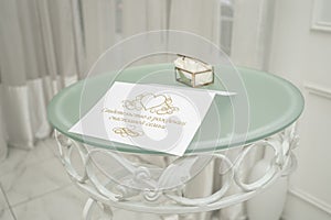 Wedding certificate on the ceremony table, which the newlyweds receive after exchanging rings