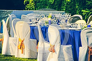 Wedding chairs catering table background in garden