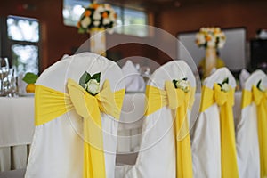 Wedding chairs decorated in a banquet hall