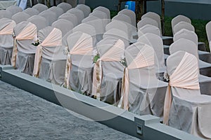 Wedding chairs decorated with bouquets of flowers