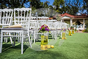 Wedding chairs on each side of archway