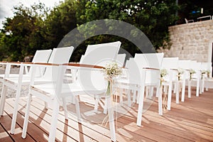Wedding chairs with flowers decoration