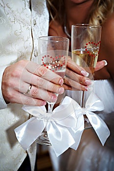 Wedding champagne glasses and bride groom hands