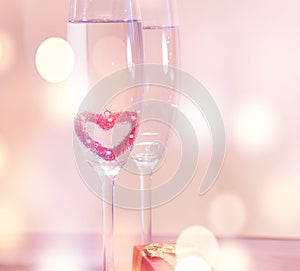 Wedding champagne glasses, romantic heart background