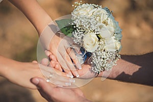 Wedding close picture of bride bouquet of flowers roses hold by couple husband and wife Romantic scene of young family love betwee