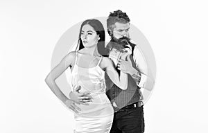 Wedding concept. Bearded hipster with bride dressed up for wedding ceremony, copy space. Woman in wedding dress and man