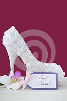 Wedding concept high heel shoe on marsala background.