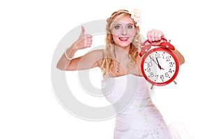 Wedding concept. Time to get married. Bride with clock.